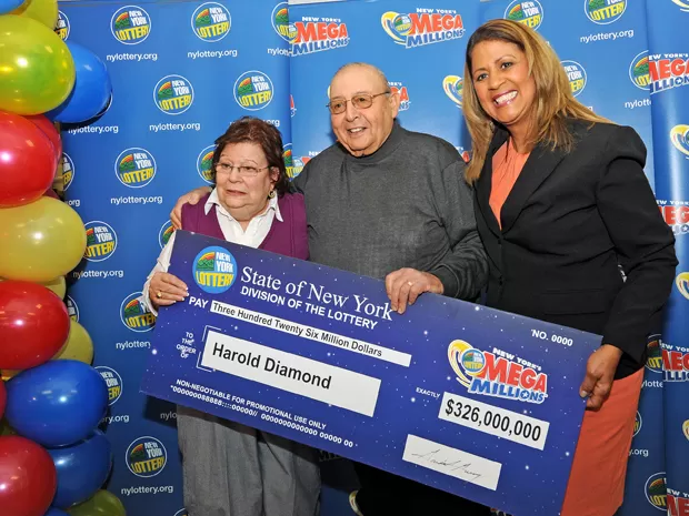 Elizabeth Caruso holding US$1,000,000 check